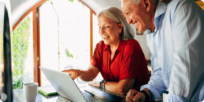 Older couple reviewing Medicare A & B premiums